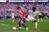 Atletico Madrid's Lee Kang-in tries to dribble the ball past Real Madrid's Aurelien Tchouameni, right, during a Spanish La Liga soccer match between Atletico Madrid and Real Madrid in Madrid, Sunday, Sept. 20, 2026. (AP Photo/Bernat Armangue)