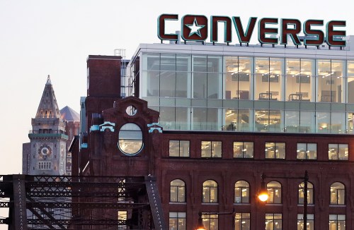 FILE - The Converse logo is displayed on the roof of the company's world headquarters in the West End neighborhood of Boston, Wednesday, Dec. 28, 2016. (AP Photo/Charles Krupa, file)