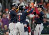 Atlanta Braves' Mike Yastrzemski, right, celebrates after his three-run home run with Mauricio Dubon, left, and Ozzie Albies, center, during the sixth inning of a baseball game against the Houston Astros, Sunday, Sept. 20, 2026, in Houston. (AP Photo/Karen Warren)