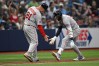 Boston Red Sox's Trevor Story, right, is congratulated by third base coach Chad Epperson (81) after hitting a solo home run during the ninth inning of a baseball game against the Tampa Bay Rays, Sunday, Sept. 20, 2026, in St. Petersburg, Fla. (AP Photo/Phelan M. Ebenhack)