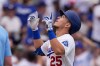 Los Angeles Dodgers' Tommy Edman gestures as he scores after hitting a solo home run during the sixth inning of a baseball game against the San Francisco Giants, Sunday, Sept. 20, 2026, in Los Angeles. (AP Photo/Mark J. Terrill)