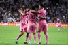 Inter Miami forward Lionel Messi (10) celebrates with midfielder Rodrigo De Paul, left, and forward Luis Suárez (9) after scoring on a free kick during the first half of an MLS soccer game against San Diego FC, Sunday, Sept. 20, 2026, in Miami. (AP Photo/David Santiago)