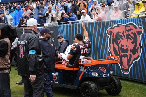 Chicago Bears quarterback Caleb Williams (18) waves as he is carted off the field after an injury during the second half of an NFL football game against the Minnesota Vikings in Chicago, Sunday, Sept. 20, 2026. (AP Photo/Nam Y. Huh)