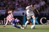 Atletico Madrid's Alex Baena falls to the ground in a clash with Real Madrid's Kylian Mbappe during a Spanish La Liga soccer match between Atletico Madrid and Real Madrid in Madrid, Sunday, Sept. 20, 2026. (AP Photo/Bernat Armangue)