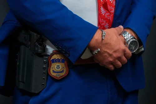 FILE - An Immigration and Customs Enforcement officer's badge is visible during an ICE hiring fair, Aug. 26, 2025, in Arlington, Texas. (AP Photo/Julio Cortez, File)