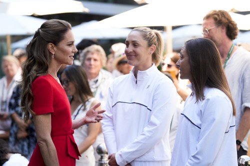Britain's Kate, Princess of Wales speaks with women's doubles finalists Gabriela Dabrowski and Luisa Stefani, right, at the Wimbledon tennis championships in London, Saturday, July 11, 2026. (Andrew Matthews/Pool Photo via AP)