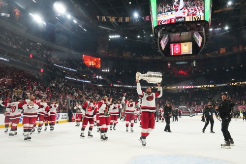 FILE - Carolina Hurricanes center Jordan Staal (11) lifts the Stanley Cup after a win over the Vegas Golden Knights in Game 6 of the NHL hockey Stanley Cup Final series, June 14, 2026, in Las Vegas. (AP Photo/Candice Ward, File)