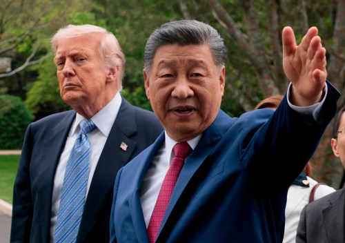 FILE - Chinese President Xi Jinping, right, gestures as he greets U.S. President Donald Trump at Zhongnanhai Garden in Beijing, China, Friday, May 15, 2026. (Evan Vucci/Pool Photo via AP, Pool)