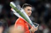 FILE - Portugal's Cristiano Ronaldo holds the trophy after winning the Nations League soccer championship at the Allianz Arena in Munich, Germany, Sunday, June 8, 2025. (AP Photo/Martin Meissner, File)