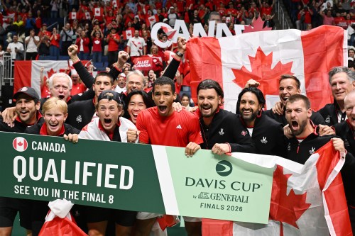 Felix Auger-Aliassime of Canada, centre, celebrates with teammates after winning his match against Arthur Rinderknech of France and winning qualification at the Davis Cup qualifier second round at the Videotron Centre in Quebec City, Saturday, Sept. 19, 2026. THE CANADIAN PRESS/Jacques Boissinot