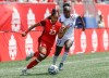 Canada's Olivia Smith (23) makes her way around Haiti's Chelsea Domond (17) during second half soccer action in Winnipeg, Saturday, May 31, 2025. THE CANADIAN PRESS/John Woods