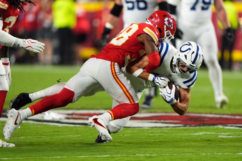 Indianapolis Colts wide receiver Alec Pierce is stopped by Kansas City Chiefs cornerback L'jarius Sneed, left, during the first half of an NFL football game Sunday, Sept. 20, 2026, in Kansas City, Mo. (AP Photo/Charlie Riedel)