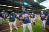 Atlanta Braves' Ronald Acuna Jr., center, celebrates on the field after a baseball game against the Houston Astros as the Braves clinched the NL East title, Sunday, Sept. 20, 2026, in Houston. (AP Photo/Karen Warren)