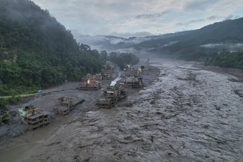 FILE - Homes sit damaged in the aftermath of flash flooding along the Trishuli River in the Trishuli Bazaar area of Nuwakot district, Nepal, Aug. 30, 2026. (AP Photo/Rajesh Kumar Singh, File)