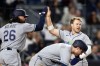 Tampa Bay Rays' Taylor Walls celebrates scoring with Ryan Vilade (26) in the seventh inning during the second baseball game of a doubleheader against the New York Yankees, Tuesday, Sept. 22, 2026, in New York. (AP Photo/Adam Hunger)