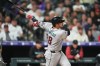 Arizona Diamondbacks' Nolan Arenado watches his solo home run off Colorado Rockies relief pitcher Zach Agnos in the seventh inning of a baseball game Tuesday, Sept. 22, 2026, in Denver. (AP Photo/David Zalubowski)