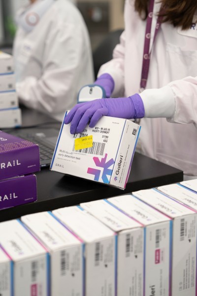 This undated photo provided by Grail Inc. on Tuesday, Sept. 22, 2026, shows an employee scanning a Galleri cancer screening test. (Grail Inc. via AP)