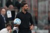 AC Milan's head coach Ruben Amorim holds the ball during the Serie A soccer match between AC Milan and Lecce, in Milan, Italy, Sunday, Sept. 20, 2026. (AP Photo/Antonio Calanni)