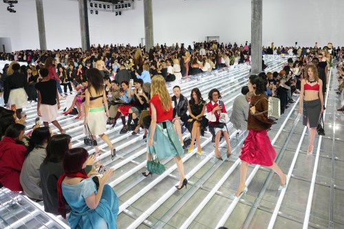 Models wear creations part of the Prada women's Spring-Summer 2027 collection presented in Milan, Italy, Tuesday, Sept. 22, 2026. (AP Photo/Luca Bruno).