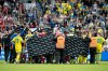 FILE - Denmark's and Ukraine's players accompany Christian Eriksen to a waiting ambulance during the international friendly soccer match between Denmark and Ukraine in Odense, Denmark, June 7, 2026, after Eriksen has collapsed on the field again while playing for Denmark's national team. (Bo Amstrup/Ritzau Scanpix via AP, File)