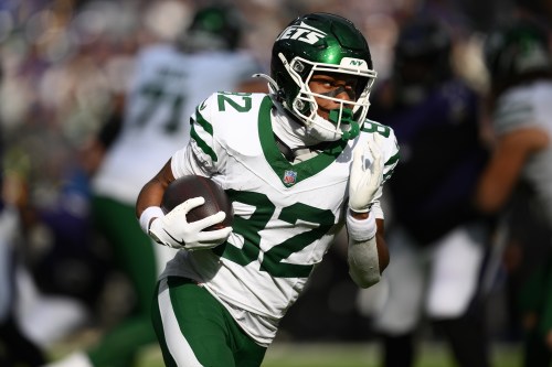 FILE - New York Jets wide receiver Arian Smith (82) carries the ball during the first half of an NFL football game against the Baltimore Ravens, Sunday, Nov. 23, 2025, in Baltimore. (AP Photo/Nick Wass, File)