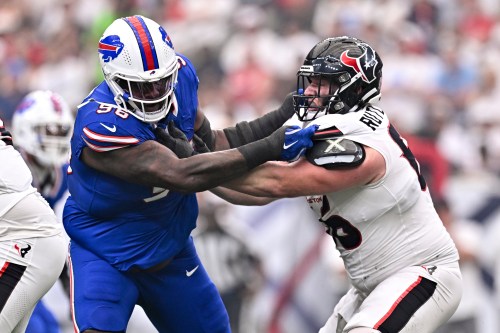 FILE - Buffalo Bills defensive tackle T.J. Sanders (98) defends as Houston Texans guard Keylan Rutledge (66) attempts to block during an NFL football game, Sept. 13, 2026, in Houston. (AP Photo/Maria Lysaker, File)