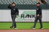 Second base umpire Tyler Jones, left, and his twin brother first base umpire Austin Jones walk on the field during the second inning in the first baseball game of a doubleheader between the Baltimore Orioles and the Toronto Blue Jays, Wednesday, Sept. 23, 2026, in Baltimore. (AP Photo/Stephanie Scarbrough)