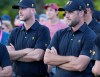 International team players Taylor Pendrith of Canada, and Corey Conners of Canada, right, as they wait for the trophy presentation at the Presidents Cup golf tournament at Royal Montreal Golf Club Sunday, September 29, 2024 in Montreal. The United States won the tournament 18.5 to 11.5. THE CANADIAN PRESS/Frank Gunn