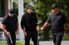 From left: International teams' Ryan Fox, of New Zealand, Nico Echavarria, of Columbia, and Ryo Hisatsune, of Japan, practice on the 14th hole prior to the start of the Presidents Cup golf tournament against the USA team at Medinah Country Club, Wednesday, Sept. 23, 2026, in Medinah, Ill. (AP Photo/Matt Slocum)