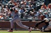Minnesota Twins' Luke Keaschall (15) watches a solo home run in front of San Francisco Giants catcher Andrew Knizner, right, during the third inning of a baseball game in San Francisco, Wednesday, Sept. 23, 2026. (AP Photo/Jed Jacobsohn)