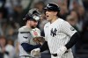 New York Yankees' Ben Rice reacts after hitting a solo home run in front of Tampa Bay Rays catcher Liam Hicks during the first inning of a baseball game Wednesday, Sept. 23, 2026, in New York. (AP Photo/Adam Hunger)