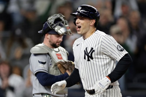 New York Yankees' Ben Rice reacts after hitting a solo home run in front of Tampa Bay Rays catcher Liam Hicks during the first inning of a baseball game Wednesday, Sept. 23, 2026, in New York. (AP Photo/Adam Hunger)