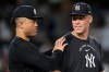 New York Yankees' Aaron Judge, right, and Giancarlo Stanton, left, celebrate after winning a baseball game against the Boston Red Sox, Friday, Aug. 28, 2026, in New York. (AP Photo/Yuki Iwamura)