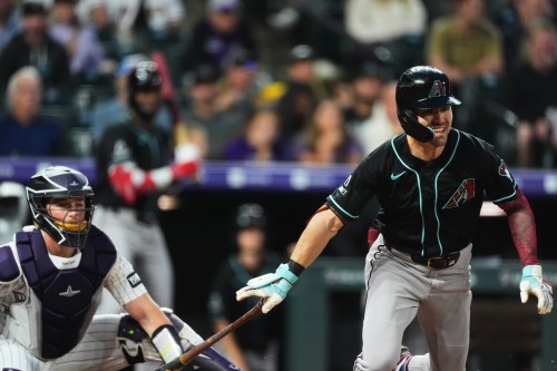 Arizona Diamondbacks' Corbin Carroll, right, breaks from the batter's box after connecting for a triple to drive in two runs as Colorado Rockies catcher Hunter Goodman looks on in the first inning of a baseball game Wednesday, Sept. 23, 2026, in Denver. (AP Photo/David Zalubowski)