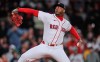 Boston Red Sox's Aroldis Chapman delivers during the ninth inning of a baseball game against the Cleveland Guardians, Wednesday, Sept. 23, 2026, in Boston. (AP Photo/Charles Krupa)