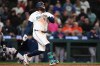 Seattle Mariners' Josh Naylor hits a walk-off RBI single in the 10th inning of a baseball game against the Houston Astros, Wednesday, Sept. 23, 2026, in Seattle. (AP Photo/Lindsey Wasson)
