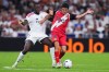 Real Madrid's Ibrahima Konate, left, challenges Rayo's Sergio Camello during the Spanish La Liga soccer match between Real Madrid and Rayo Vallecano in Madrid, Spain, Saturday, Sept. 12, 2026. (AP Photo/Manu Fernandez)