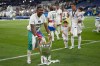 FILE - Real Madrid's David Alaba poses with the trophy after winning the Champions League final soccer match between Liverpool and Real Madrid at the Stade de France in Saint Denis, near Paris, May 28, 2022. (AP Photo/Kirsty Wigglesworth, File)