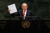 Israeli Prime Minister Benjamin Netanyahu holds up a Starlink satellite internet dish a he speaks during the 81st session of the United Nations General Assembly at United Nations headquarters, Thursday, Sept. 24, 2026. (AP Photo/Seth Wenig)