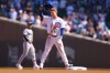 Chicago Cubs' Pete Crow-Armstrong raises his helmet to the crowd after stealing second base for his 40th steal of the season during the first inning of a baseball game against the Miami Marlins, Thursday , Sept. 24, 2026, in Chicago. (AP Photo/Melissa Tamez)