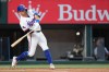 Texas Rangers' Josh Jung swings at a pitch before hitting a two-run home run against the New York Mets during the first inning of a baseball game Thursday, Sept. 24, 2026, in Arlington, Texas. (AP Photo/Julio Cortez)