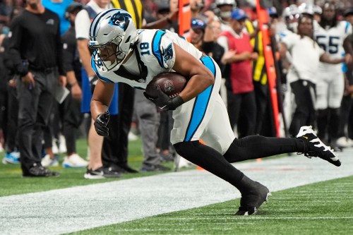 Carolina Panthers wide receiver Jalen Coker (18) makes a catch against Atlanta Falcons cornerback Mike Hughes (21) during an NFL football game in Atlanta, Sunday, Sept. 20, 2026. (AP Photo/Mike Stewart)
