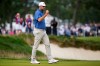 USA teams' Scottie Scheffler reacts to making his birdie putt on the first hole against the International teams during the first round four-ball match at the Presidents Cup golf tournament at Medinah Country Club, Thursday, Sept. 24, 2026, in Medinah, Ill. (AP Photo/Matt Slocum)