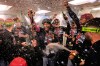 Cleveland Guardians' Angel Martínez, center, celebrates with teammates after clinching a postseason playoff spot following a baseball game against the Boston Red Sox, Thursday, Sept. 24, 2026, in Boston. (AP Photo/Charles Krupa)