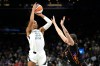 Las Vegas Aces center A'ja Wilson (22) shoots over Phoenix Mercury forward Marta Suarez during the second half of a WNBA basketball game, Thursday, Sept. 24, 2026, in Phoenix. (AP Photo/Ross D. Franklin)