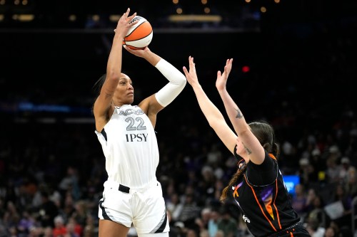 Las Vegas Aces center A'ja Wilson (22) shoots over Phoenix Mercury forward Marta Suarez during the second half of a WNBA basketball game, Thursday, Sept. 24, 2026, in Phoenix. (AP Photo/Ross D. Franklin)