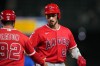 Los Angeles Angels' Bryce Teodosio celebrates an RBI single with first base/outfield coach Adam Eaton (92) during the eighth inning of a baseball game against the Seattle Mariners, Thursday, Sept. 24, 2026, in Seattle. (AP Photo/Lindsey Wasson)
