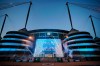 FILE - A banner celebrating their title win is illuminated outside Manchester City's Etihad stadium in Manchester, England, Saturday, May 20, 2023. (AP Photo/Jon Super, File)