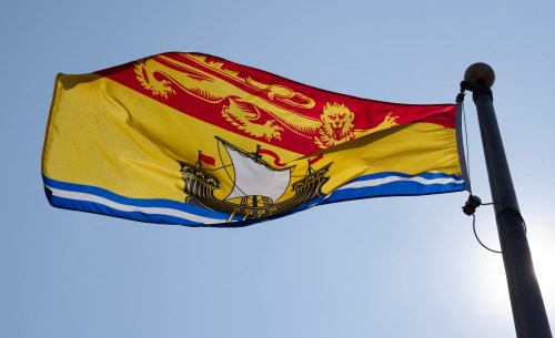 The New Brunswick provincial flag flies on a flagpole in Ottawa, Friday, July 24, 2026 in Ottawa. THE CANADIAN PRESS/Adrian Wyld
