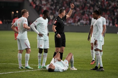 France's Kylian Mbappe lieas on the ground after he scored and injured himself during the UEFA Nations League soccer match between Turkey and France in Izmit, Turkey, Friday, Sept. 25, 2026. (AP Photo/Khalil Hamra)